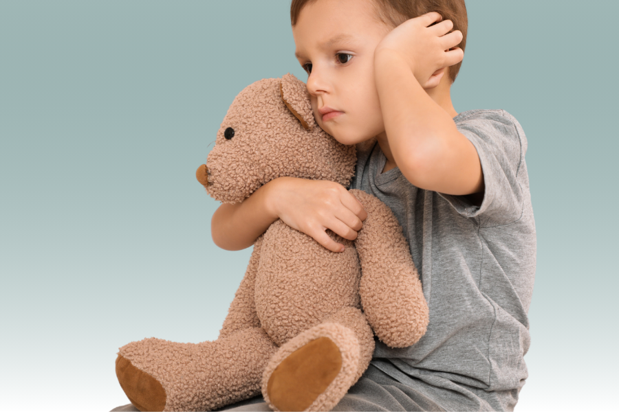Child holding ear